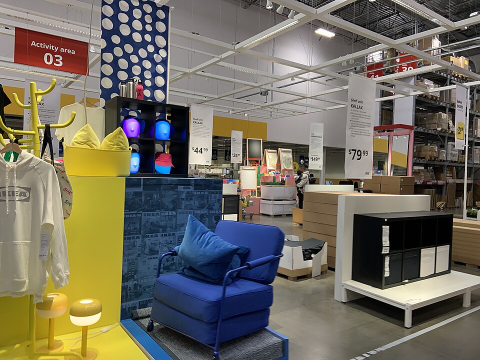 IKEA furniture showroom with chair and KALLAX shelving